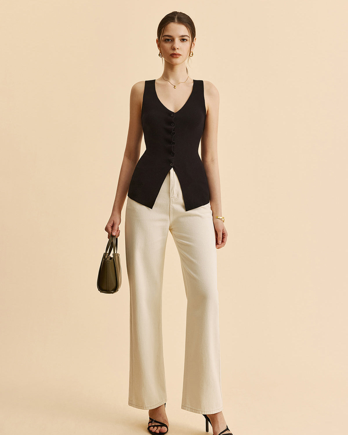 Kıvrımlı Kenar Detaylı Yırtmaçlı Triko Yelek