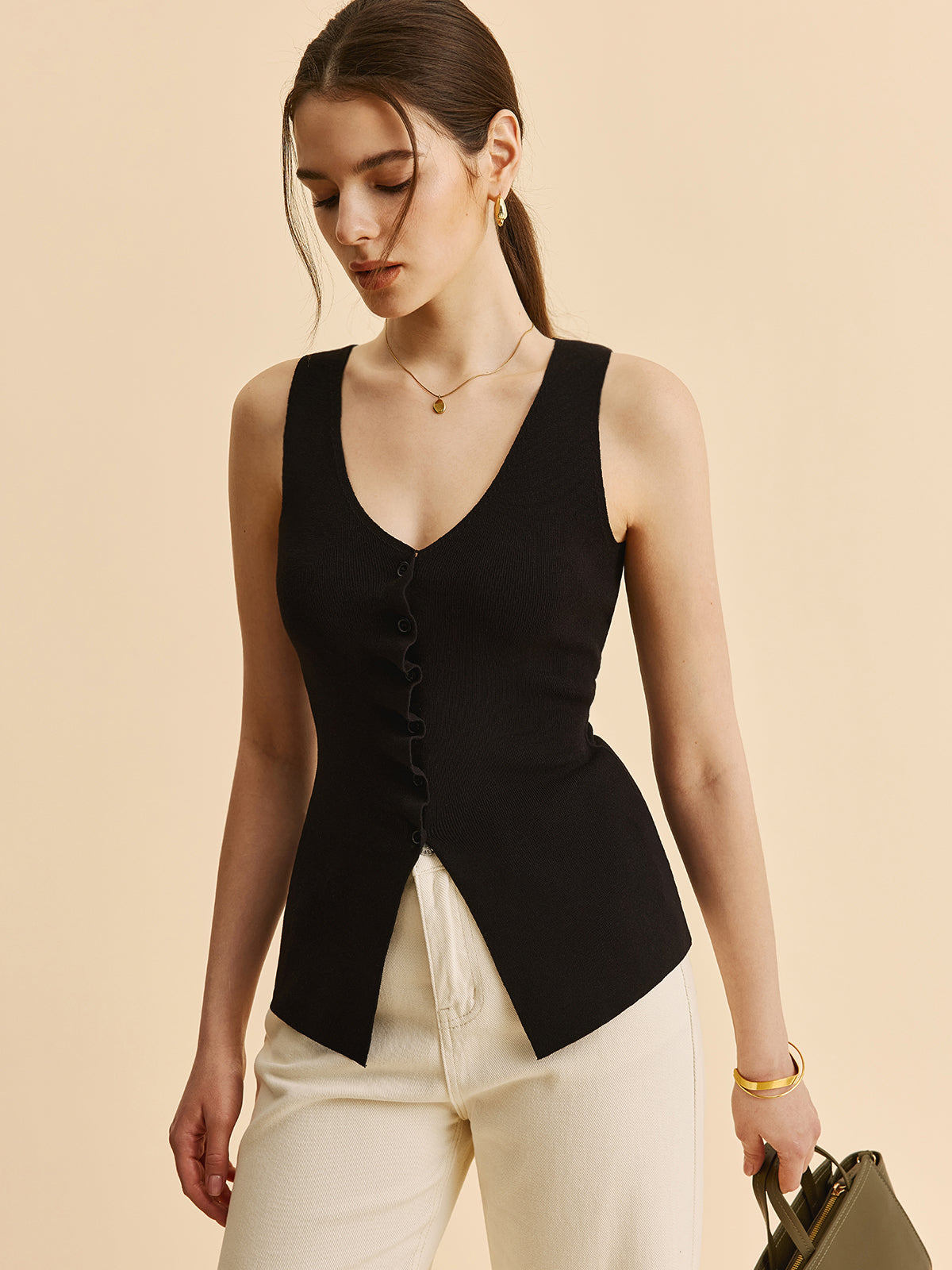 Kıvrımlı Kenar Detaylı Yırtmaçlı Triko Yelek