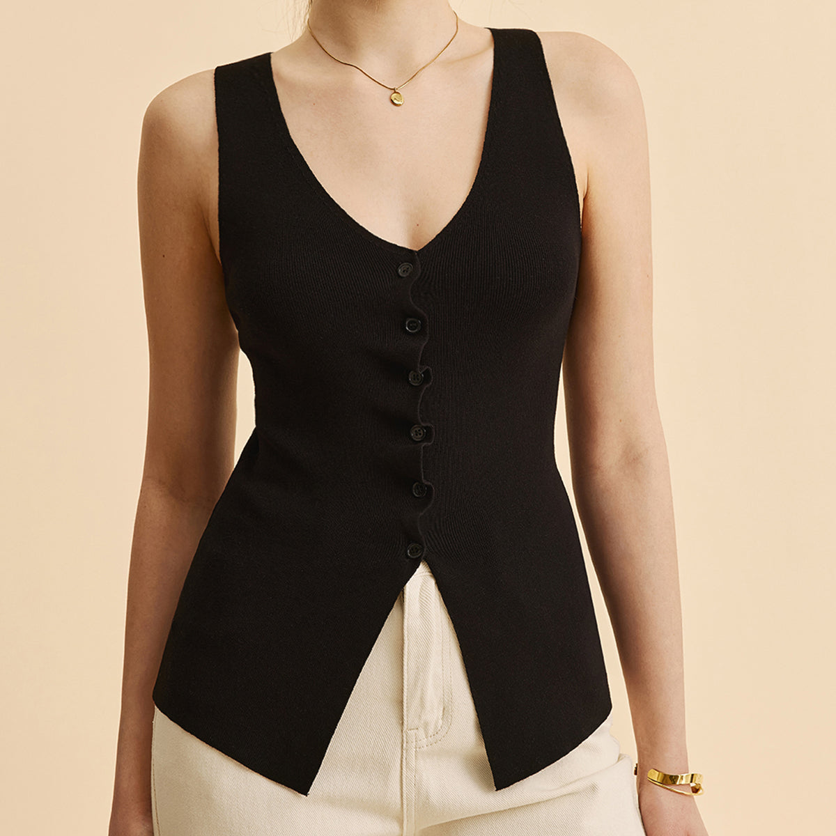 Kıvrımlı Kenar Detaylı Yırtmaçlı Triko Yelek