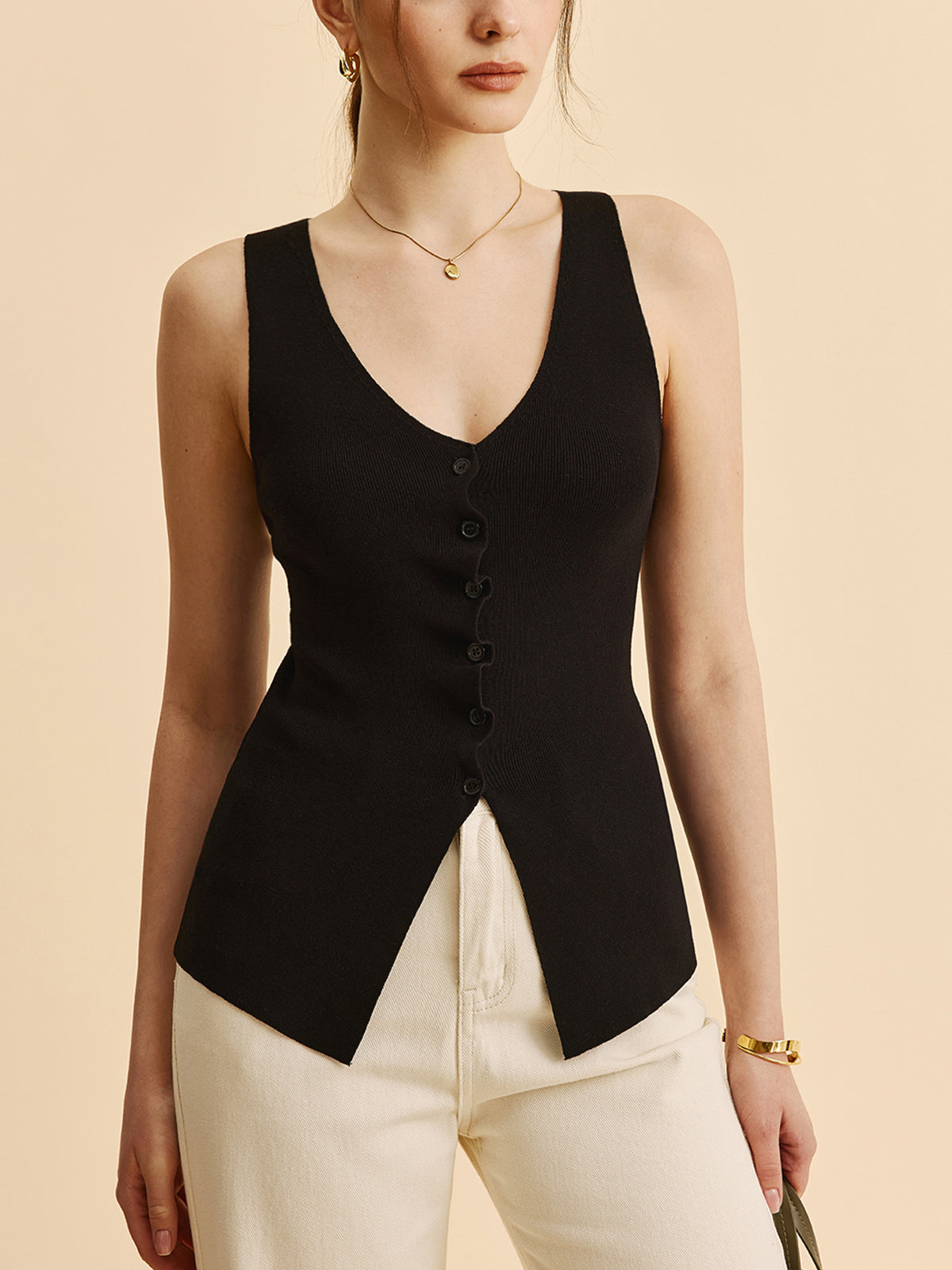 Kıvrımlı Kenar Detaylı Yırtmaçlı Triko Yelek